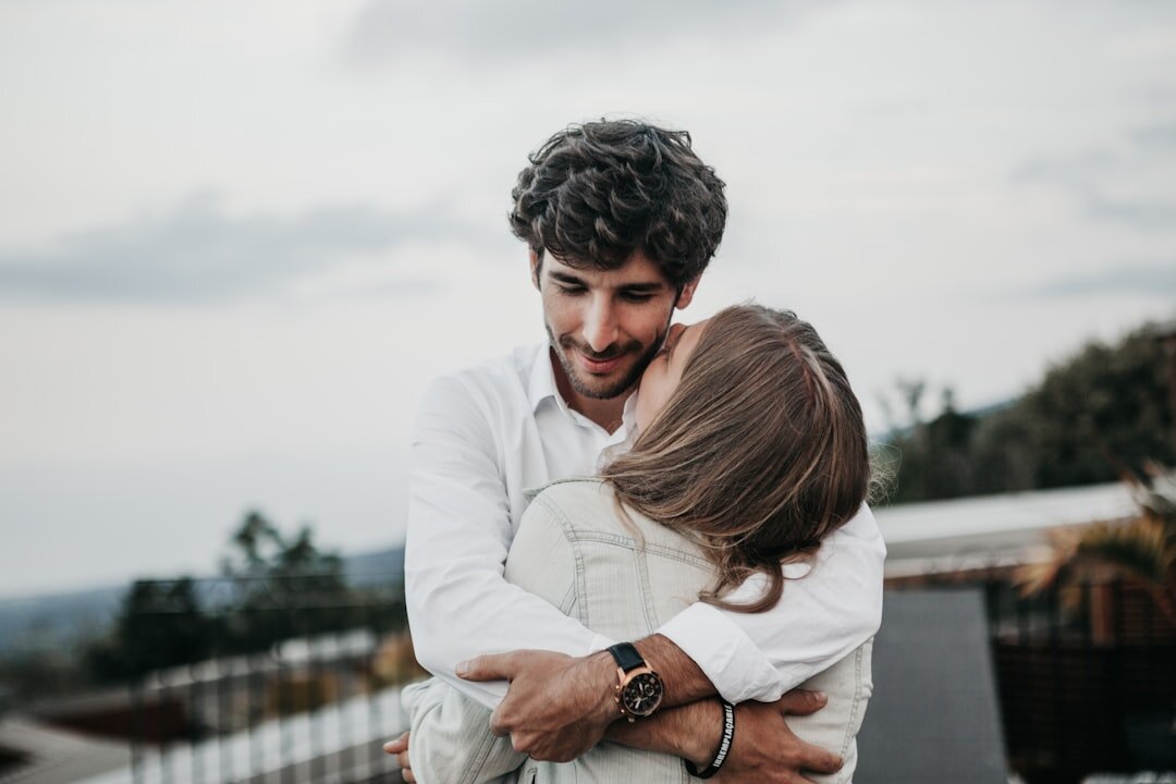 couple reconciling hug